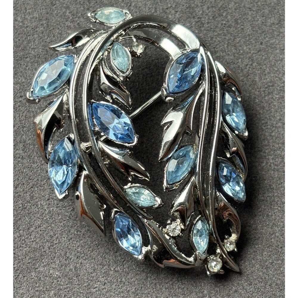 Signed Trifari Blue Rhinestone Swirl Brooch Silver Tone Floral Pin